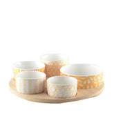 Appetizer set of 5 bowls on a round wooden tray