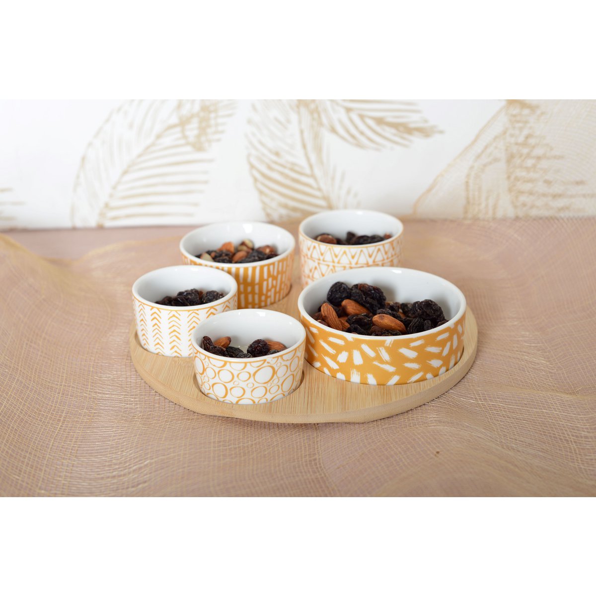 Appetizer set of 5 bowls on a round wooden tray
