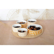Appetizer set of 5 bowls on a round wooden tray